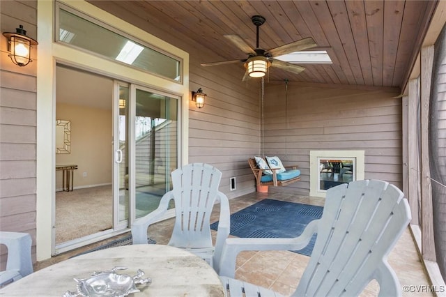 exterior space with ceiling fan and outdoor dining area
