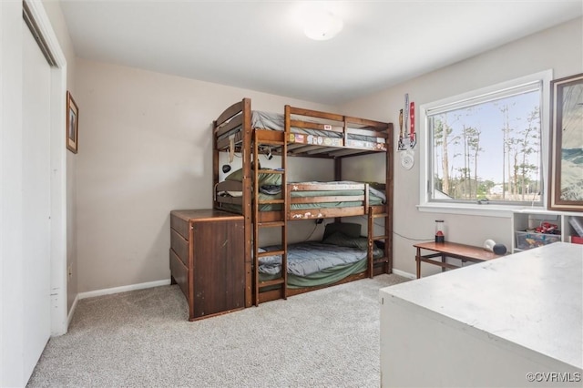 bedroom featuring baseboards and carpet floors