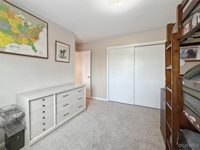 carpeted bedroom with a closet