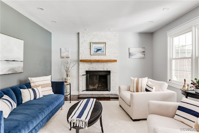 living area with a fireplace and recessed lighting