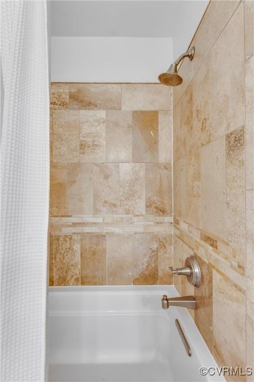 bathroom with shower / tub combo