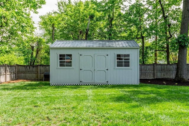 view of shed featuring a fenced backyard