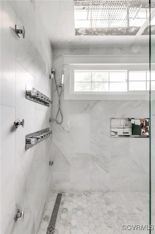 bathroom with tiled shower