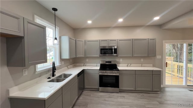 731 Wilson St, Petersburg, VA 23803 - kitchen featuring appliances with stainless steel finishes, a sink, gray cabinetry, healthy amount of natural light, and recessed lighting