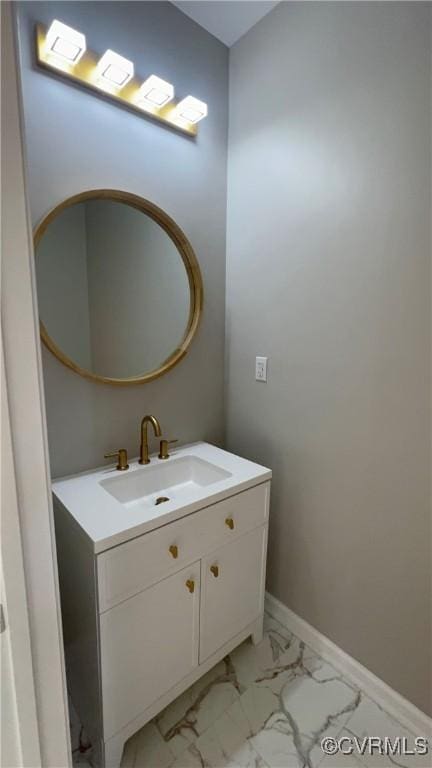 731 Wilson St, Petersburg, VA 23803 - bathroom featuring marble look tiles, vanity, and baseboards