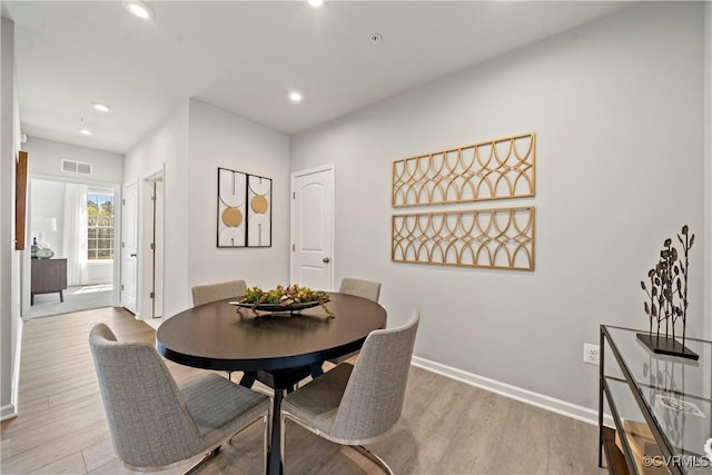 dining area featuring baseboards, recessed lighting, visible vents, and wood finished floors