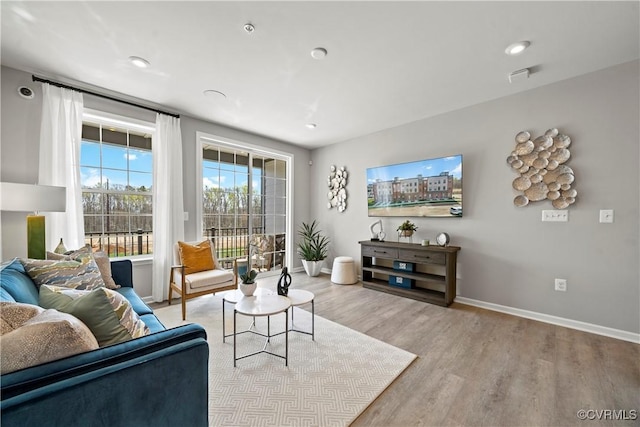living room with wood finished floors and baseboards