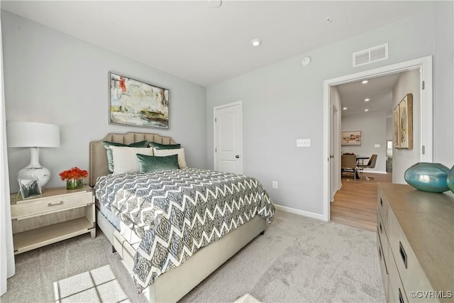 bedroom with light carpet, baseboards, visible vents, and recessed lighting