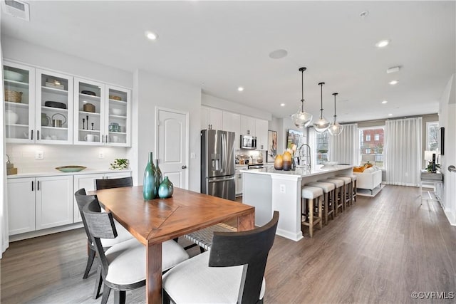dining room featuring recessed lighting, visible vents, and dark wood-style floors
