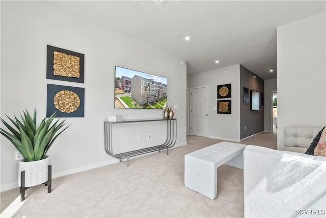 living area with baseboards, recessed lighting, and carpet