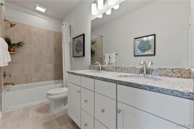 bathroom with toilet, shower / bath combination with curtain, a sink, and double vanity