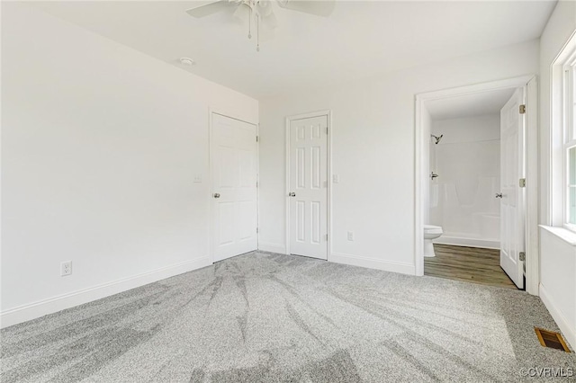 1684 Halls Store Rd, Mineral, VA 23117 - unfurnished bedroom with baseboards, carpet flooring, connected bathroom, and visible vents