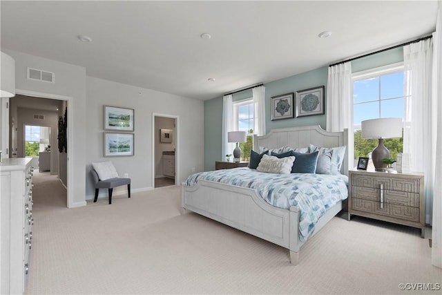 bedroom featuring light colored carpet, baseboards, visible vents, and multiple windows