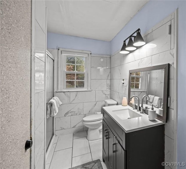 2704 Greenway Ave, Henrico, VA 23228 - bathroom with vanity, tile walls, marble finish floors, a shower stall, and toilet