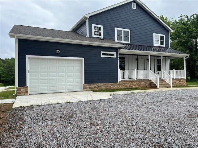 1506 Old Poole Rd, Alberta, VA 23821 - view of front facade with driveway, a porch, a garage, and board and batten siding