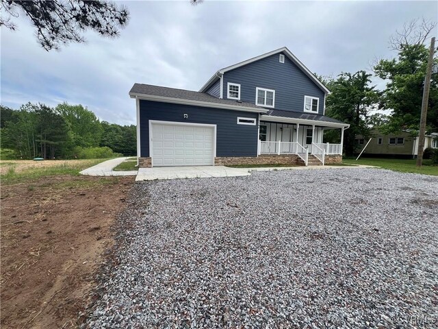 1506 Old Poole Rd, Alberta, VA 23821 - view of front of house featuring a porch, a garage, and gravel driveway