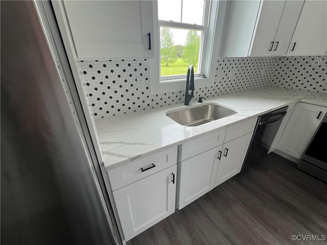 1506 Old Poole Rd, Alberta, VA 23821 - kitchen featuring freestanding refrigerator, light stone countertops, a sink, white cabinetry, and backsplash