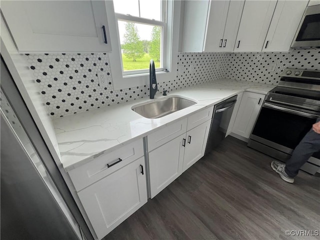 1506 Old Poole Rd, Alberta, VA 23821 - kitchen with a sink, white cabinets, dark wood finished floors, appliances with stainless steel finishes, and decorative backsplash
