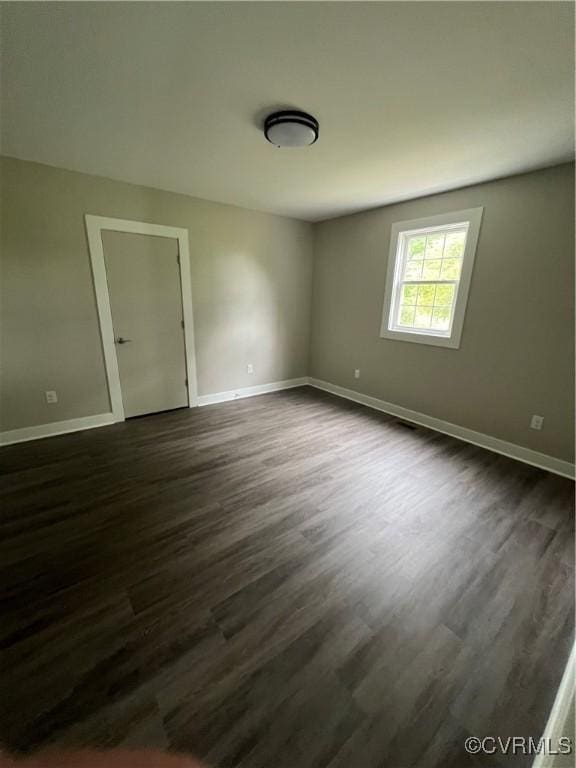1506 Old Poole Rd, Alberta, VA 23821 - unfurnished room featuring dark wood-style flooring and baseboards