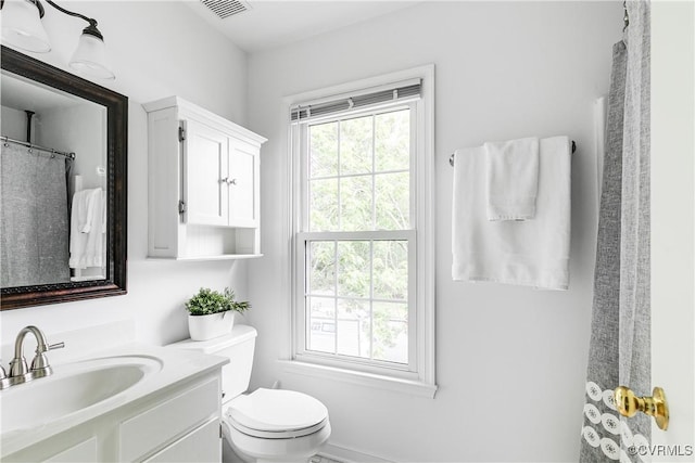 full bathroom featuring toilet and vanity