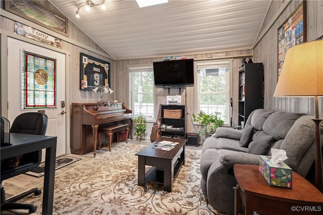living room with lofted ceiling and wood ceiling