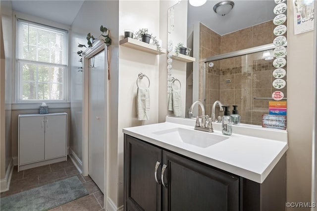 bathroom with vanity and tiled shower