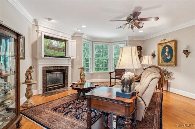 2410 Walhala Dr, North Chesterfield, VA 23236 - living room featuring a premium fireplace, baseboards, ceiling fan, wood finished floors, and ornamental molding