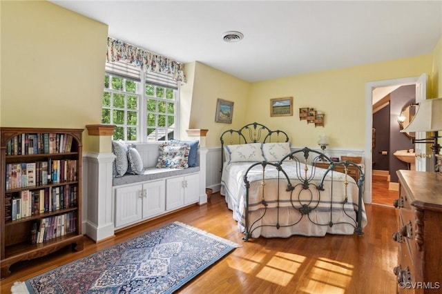 2410 Walhala Dr, North Chesterfield, VA 23236 - bedroom with wood finished floors and a wainscoted wall