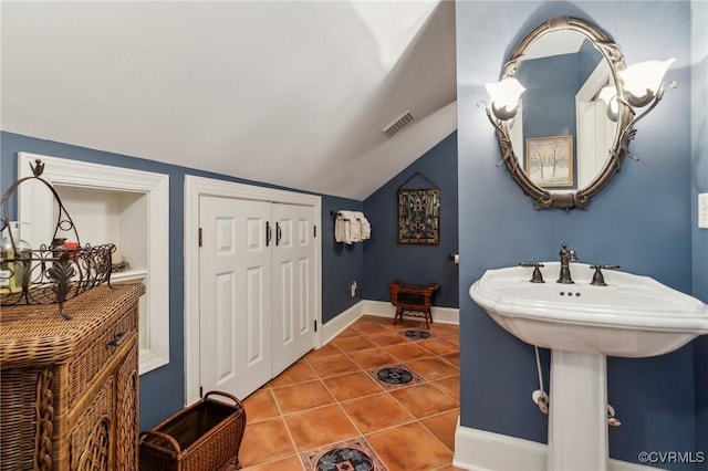 2410 Walhala Dr, North Chesterfield, VA 23236 - bathroom featuring vaulted ceiling, tile patterned floors, and baseboards