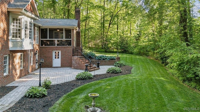 2410 Walhala Dr, North Chesterfield, VA 23236 - view of green lawn featuring a sunroom, a patio, and stairway