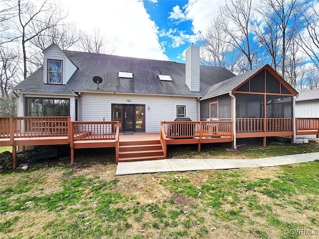 12448 Whisana Ln, Ashland, VA 23005 - rear view of house with a sunroom, a deck, a chimney, a yard, and roof with shingles