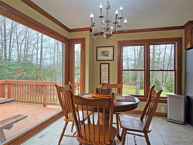 12448 Whisana Ln, Ashland, VA 23005 - dining area featuring light tile patterned flooring, a chandelier, healthy amount of natural light, and crown molding