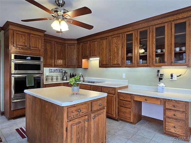 12448 Whisana Ln, Ashland, VA 23005 - kitchen with a warming drawer, stainless steel double oven, light countertops, and light tile patterned floors