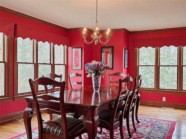 12448 Whisana Ln, Ashland, VA 23005 - dining space with a chandelier, light wood finished floors, baseboards, and ornamental molding