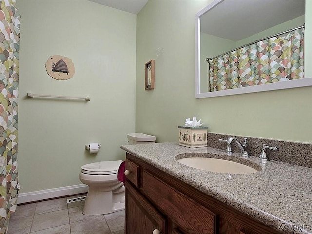 12448 Whisana Ln, Ashland, VA 23005 - full bathroom with tile patterned floors, toilet, vanity, and baseboards