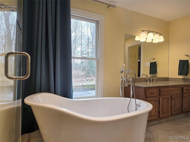 12448 Whisana Ln, Ashland, VA 23005 - full bathroom featuring vanity, a soaking tub, and tile patterned flooring