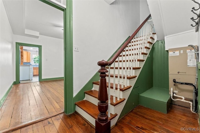 stairway featuring wood-type flooring