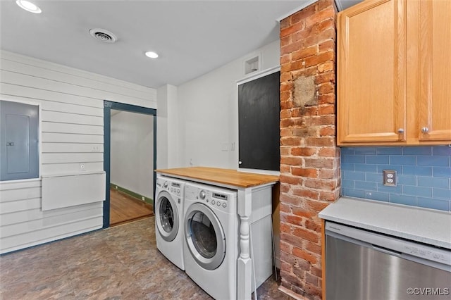 laundry room featuring independent washer and dryer, electric panel, and recessed lighting