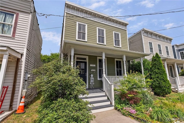 italianate home featuring a porch
