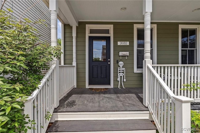property entrance with covered porch