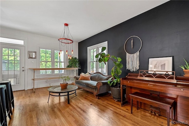 living area featuring wood finished floors and healthy amount of natural light