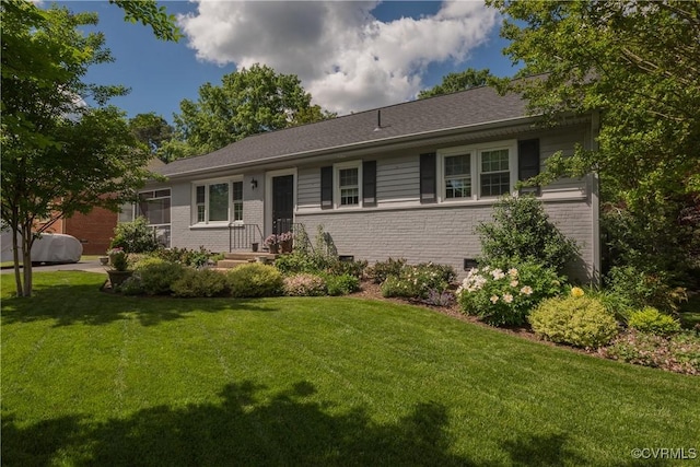 ranch-style house with brick siding and a front yard