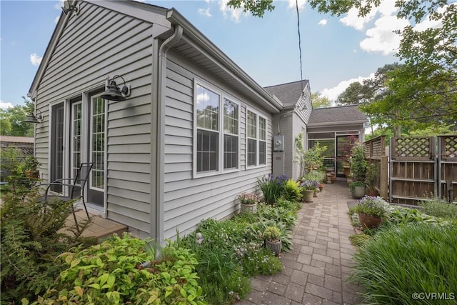view of home's exterior with fence