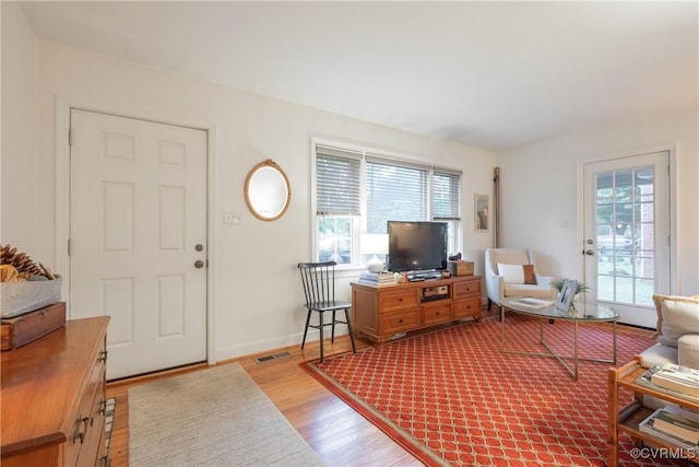 living room with wood finished floors and baseboards