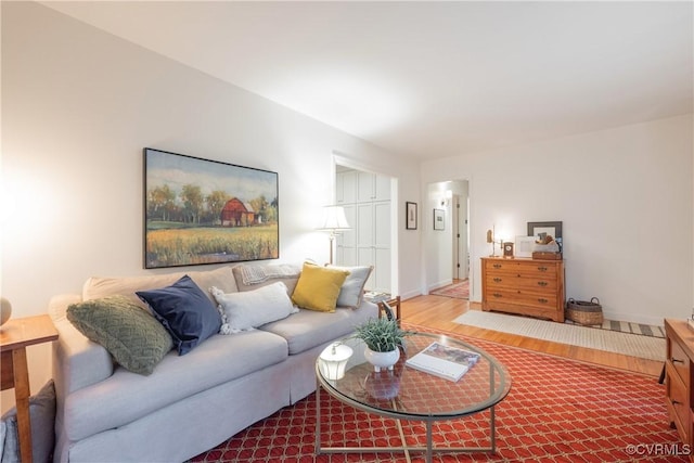 living room featuring wood finished floors and baseboards