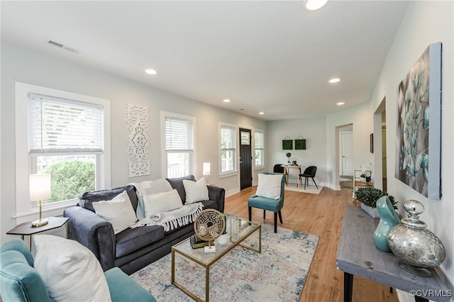 living room with recessed lighting and light wood finished floors
