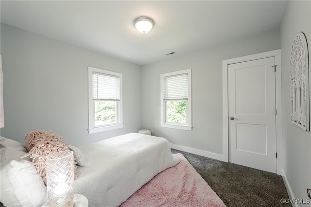 bedroom featuring carpet floors and baseboards