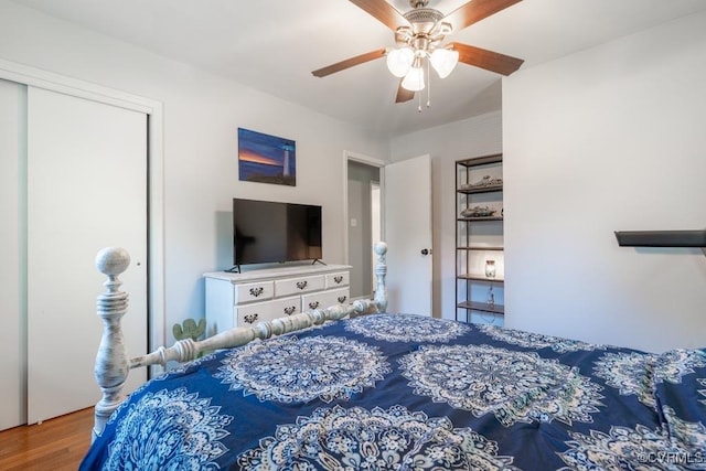 bedroom with wood finished floors and ceiling fan