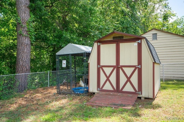 view of shed with fence