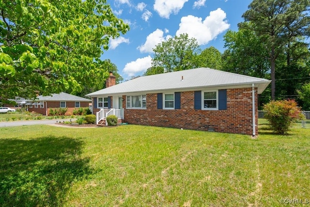 single story home featuring a chimney, brick siding, and crawl space